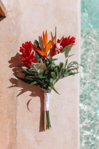 Beautiful orange and red flower bouquet for villa delivery